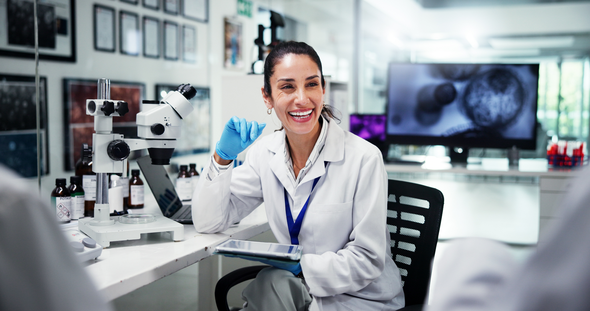 Omni Research scientist reviewing analytical data at the microscope