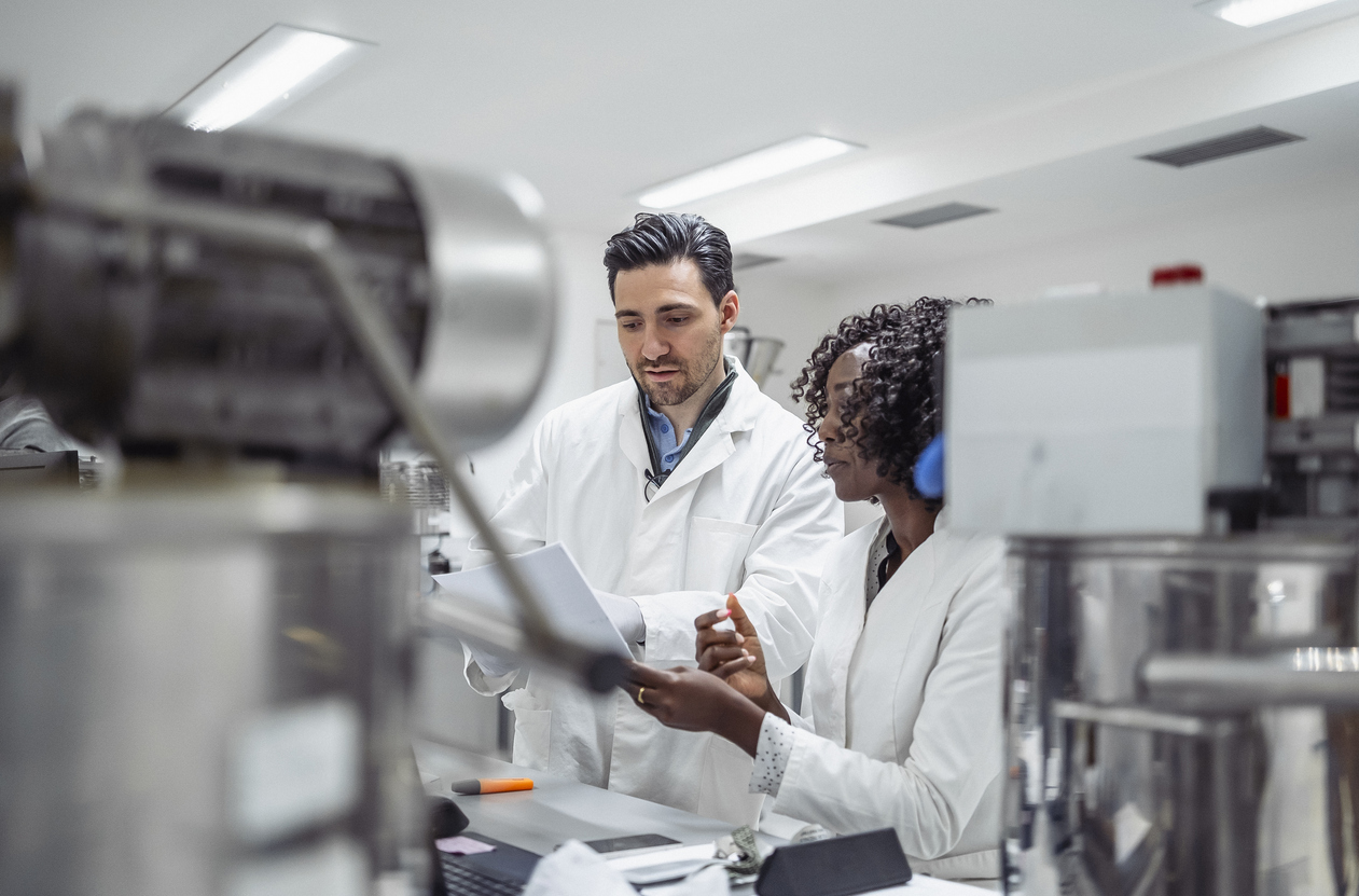 Omni Research scientists reviewing analytical data in the QC lab